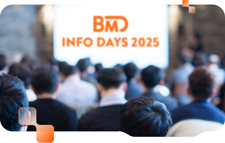 Publikum von hinten und auf einer Leinwand steht "BMD Info Days 2025".